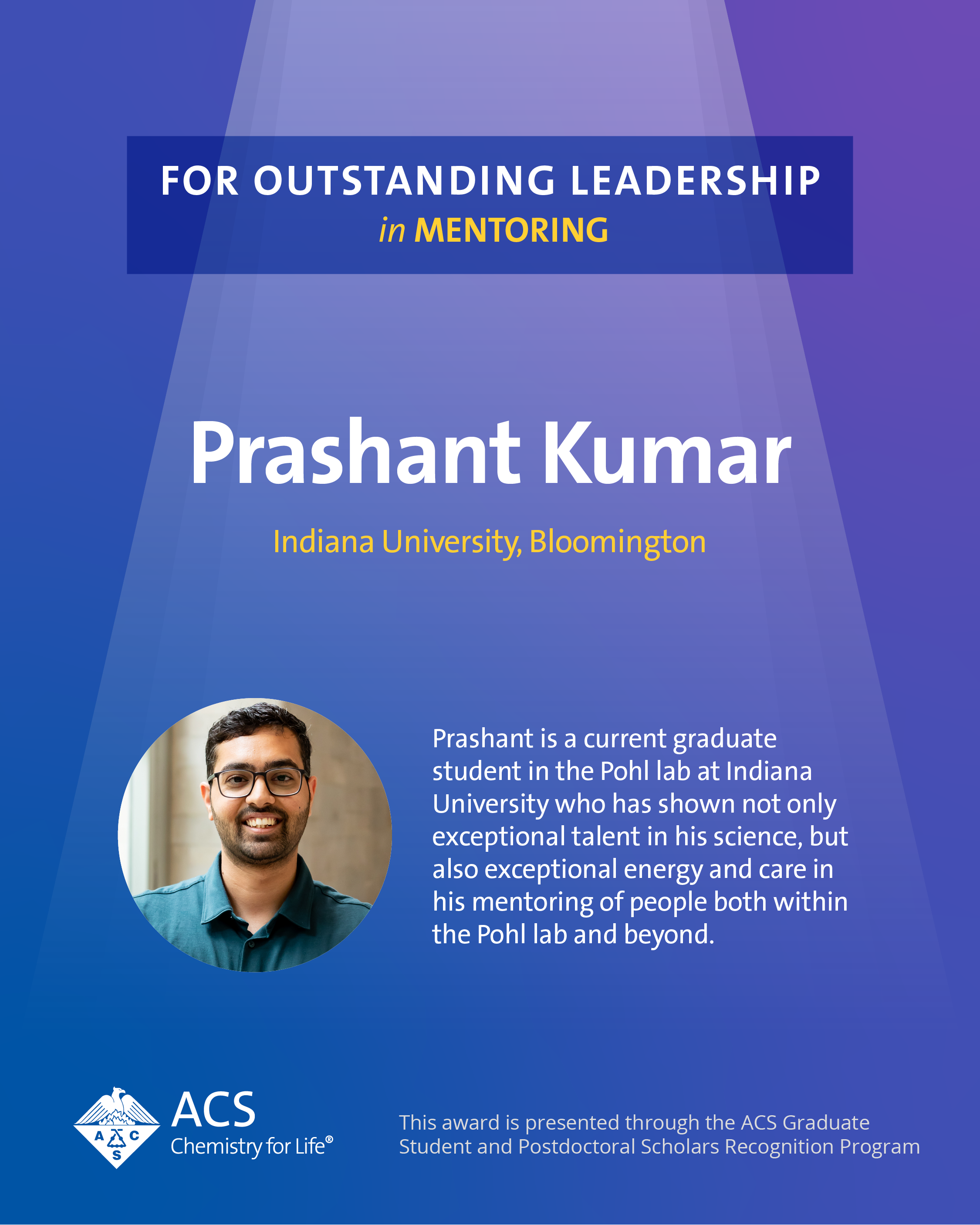 Eight members of the Pohl lab standing in front of a periodic table at the University of Toledo